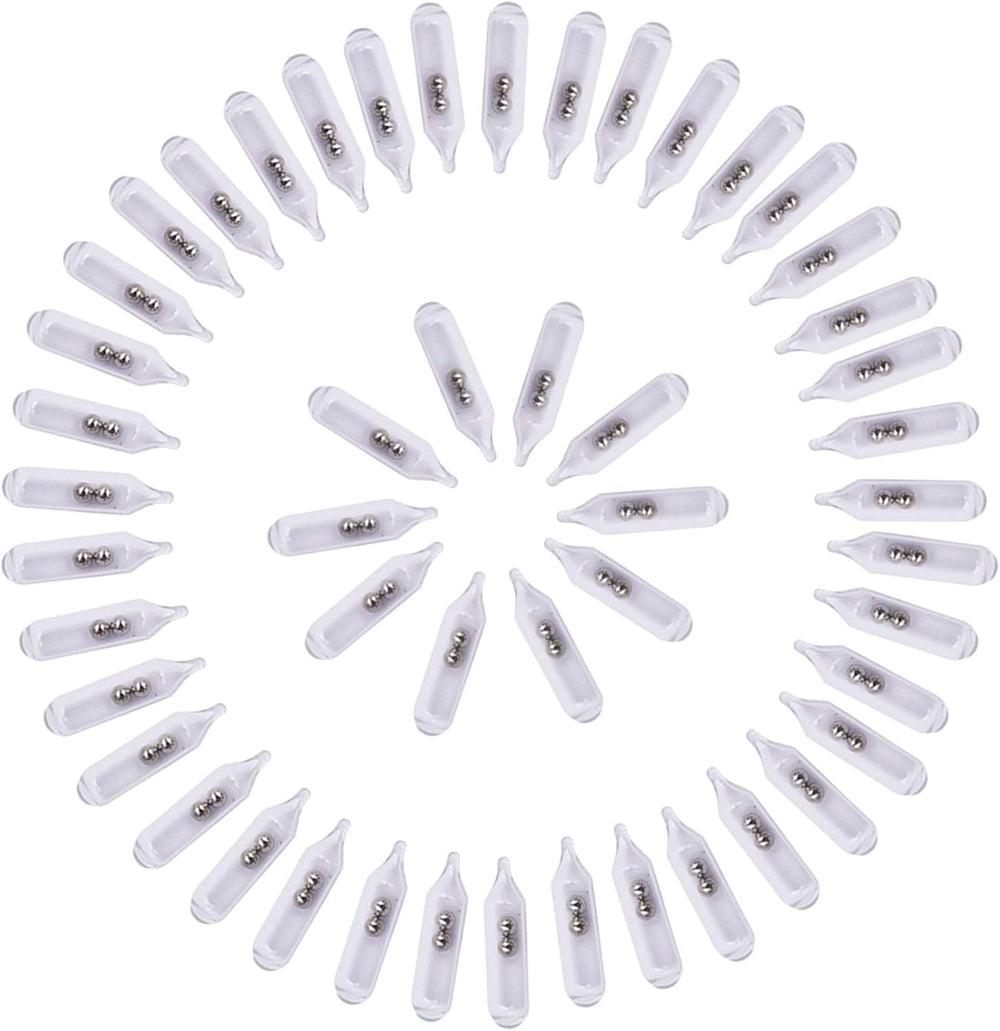 Close-up of glass rattles and insert tube for jig fishing lures