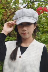 Back elastic adjustment on baker boy hat