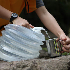 AceCamp Accordion Jerrycans folded flat for compact camping storage.