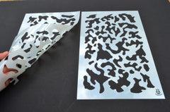 Acid Tactical camouflage stencil set shown on metal or plastic with spray-through versatility