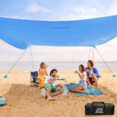 ADesign windproof beach tent with sandbags stabilizes shade on windy beaches.