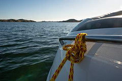 Airhead Bungee Tow Rope on water displays red-yellow visibility improving safety.