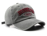Ajux Vintage Dist distressed hat front view in grey denim for everyday wear.