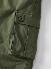 AKHIKING women's cargo pants green pocket flap detail showing secure storage options