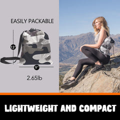 AlphaBeing inflatable lounger fully inflated on the beach for relaxing comfort.