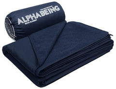 AlphaBeing waterproof outdoor blanket packed in its storage bag for travel