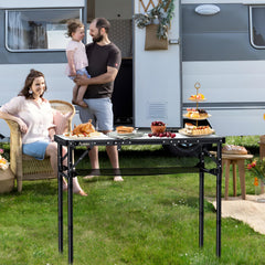 Anbte folding camping table with a carrying handle ready for quick transport and setup.