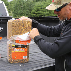 Antler King block on trail feeder illustrates deer can discover year-round source.