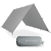 AquaQuest Defender Tarp coverage shields a campsite from rain