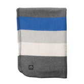 Arcturus Rainier Blanket folded for compact warmth on a camping trip.