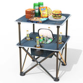 ARMOR CASTLE folding beach table on sand demonstrates quick setup for a seaside picnic.