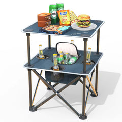 ARMOR CASTLE folding beach table on sand demonstrates quick setup for a seaside picnic.