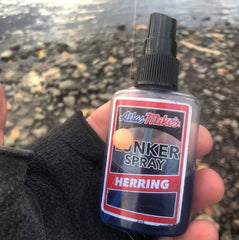 Close-up of Atlas-Mike's Lunker Spray bottles showing Herring and Shrimp scents