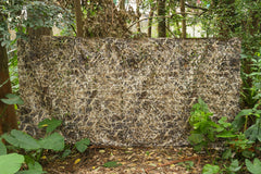 AUSCAMOTEK camo netting ground blind setup demonstrates quick concealment.