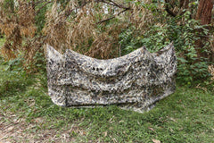 AUSCAMOTEK ground blind in Wetland Dry Reed blends into marshy brush for water-edge hunts.