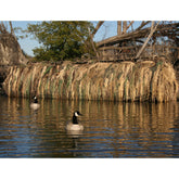 Avery KillerWeed Boat Blind Kit displayed on a marsh hunting setup for concealment.