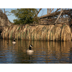 Avery KillerWeed Boat Blind Kit displayed on a marsh hunting setup for concealment.