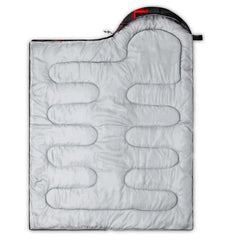 Axolotl Gamepad Sleeping Bag rolled in compression sack for easy travel.