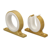 Banapoy wall-mounted fishing rod holders in gold securely store rods for easy access.