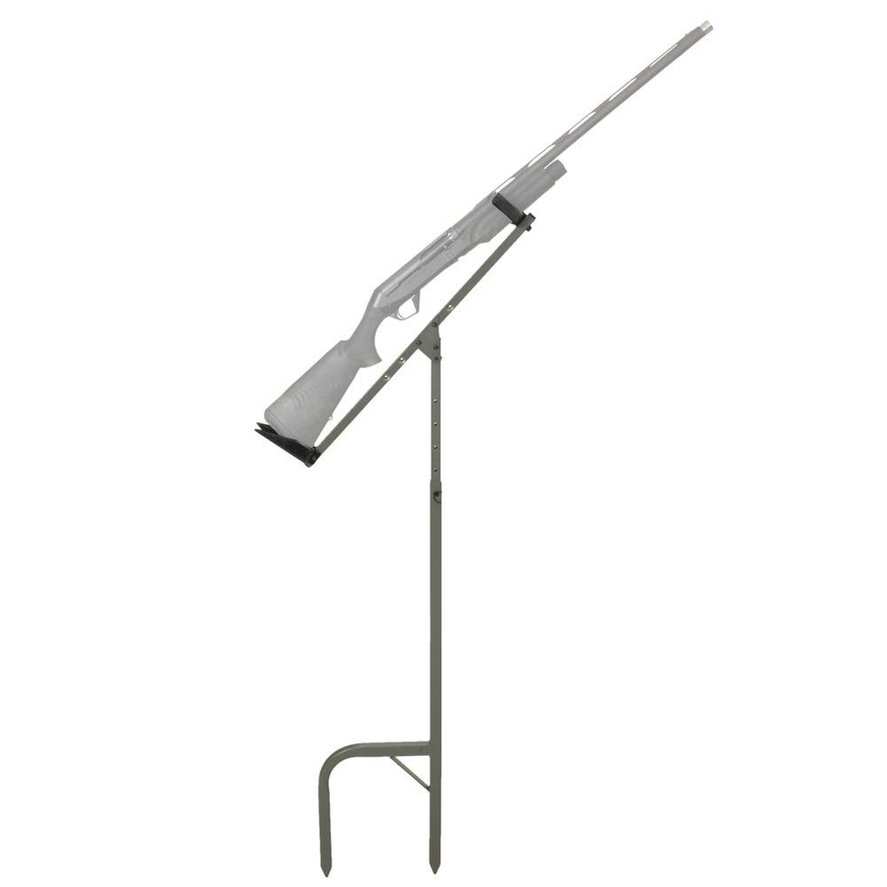 Banded Gun Stick Hands-Free Holder in muddy terrain securing a shotgun for hands-free use