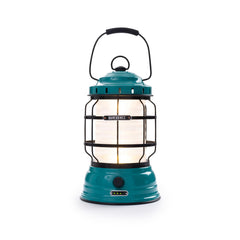 Barebones Forest Lantern teal light on campsite creates cozy ambience.