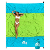Beach Dudes Green Spirit blanket on sand for a family beach day