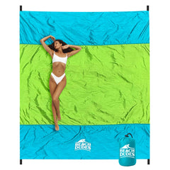 Beach Dudes Green Spirit blanket on sand for a family beach day