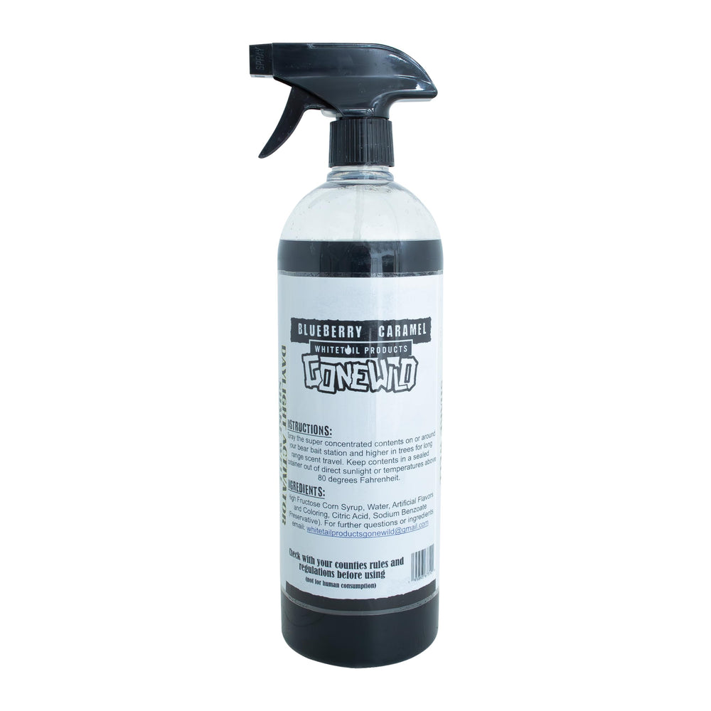 Bear attractant spray being applied at a bait site