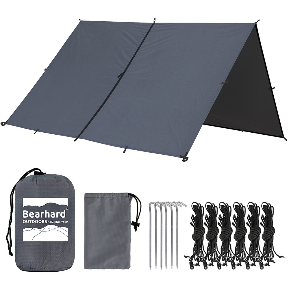 Bearhard 10x10 tarp setup with hammock shows versatile shelter for camping and rain protection.