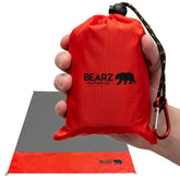 BEARZ Outdoor pocket blanket folded compact for easy packing.