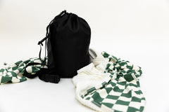 Beddy's dual-sided travel blanket in a compact case for airplane comfort