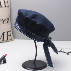 Besforta navy sailor hat bow-knot closeup showing adjustable band for comfort.