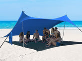 Bestset beach tent setup backview shows wide shade coverage on a windy beach.