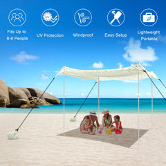 BEW Beach Tent sandbags and poles stabilize shelter on windy beach.