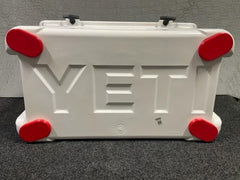 Bigfoot red sliding feet in a truck bed for quick repositioning of the cooler.