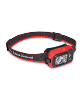 BLACK DIAMOND Storm 450 headlamp worn on strap for hands-free hiking visibility.