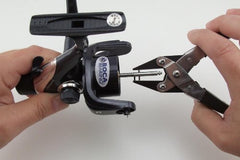 BOCA BEARING spool pin pliers in use safely remove and reinstall reel pins with ease.