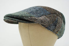 Galway patchwork tweed cap top view showing compact travel friendly silhouette