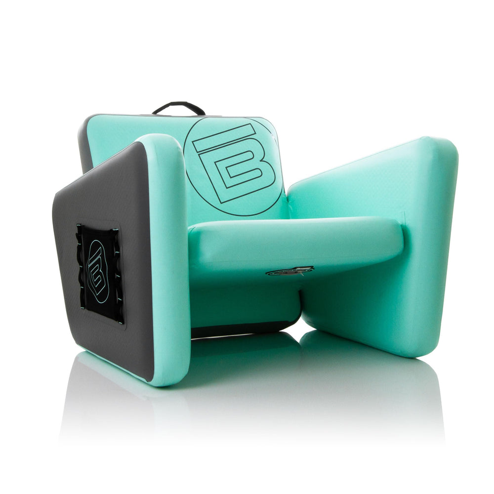 BOTE Aero inflatable chair on the beach offers portable comfort.