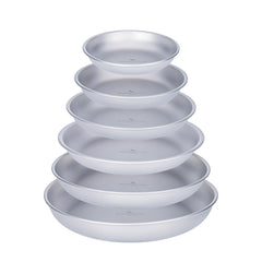 Boundless Voyage titanium camping plate dinner on a rugged table for outdoor meals.
