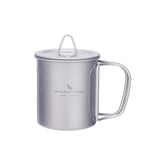 Boundless Voyage titanium cup with lid open, foldable handle for outdoor use