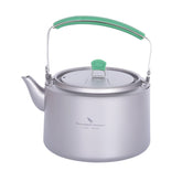 Boundless Voyage titanium kettle 1200ml ready to pour hot water outdoors.