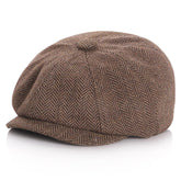 Kid wearing a coffee colored newsboy cap