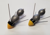 Breakaway Super Sinker 7oz with locked wires anchors in sand for surf fishing.