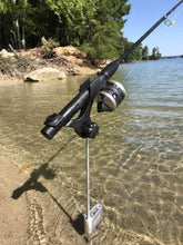 Brocraft bank rod holder in use, keeping hands free for a steady cast.