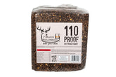 Buck Bourbon deer attractant block 25 lb in field setup for deer lure