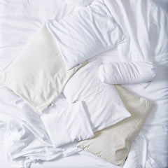 Bucky pillow in bed demonstrates neck and head support for comfortable alignment.