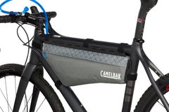 Adjustable tube clip keeps hydration tube in place for quick access.