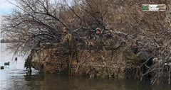 CamoSystems waterproof camouflage netting demonstrates all-weather protection against rain and sun.