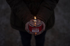 CandleLife emergency candle in camping setup, compact and portable.